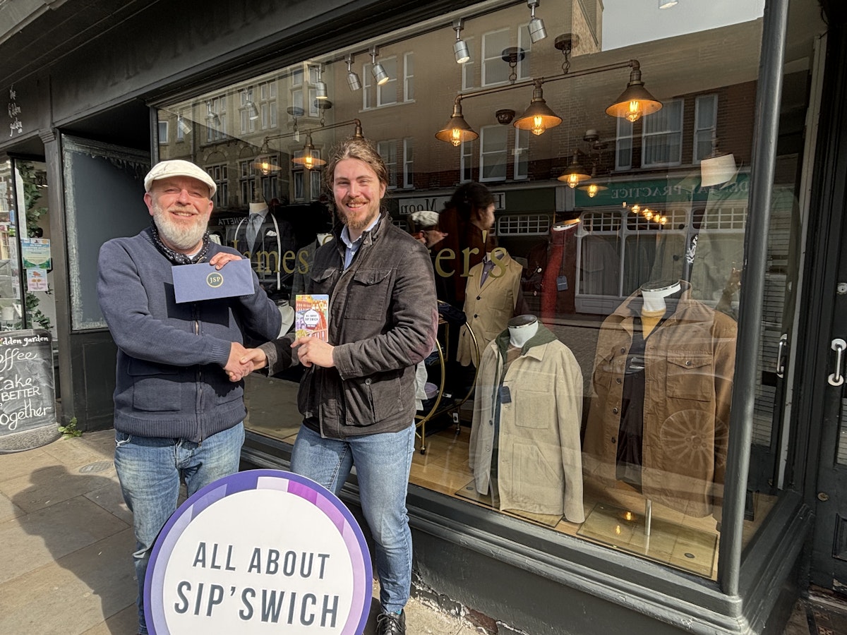 Mark Hubert of James St. Peters presenting Adam Littler with his voucher